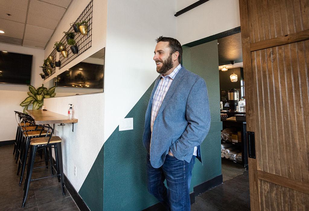 Man in blazer working inside Granite City Workspaces, Folsom CA
