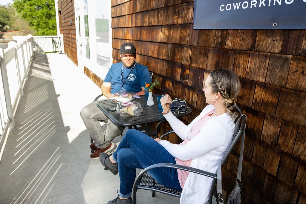 Outdoor patio with building signage at Granite City Workspaces, Historic Folsom CA