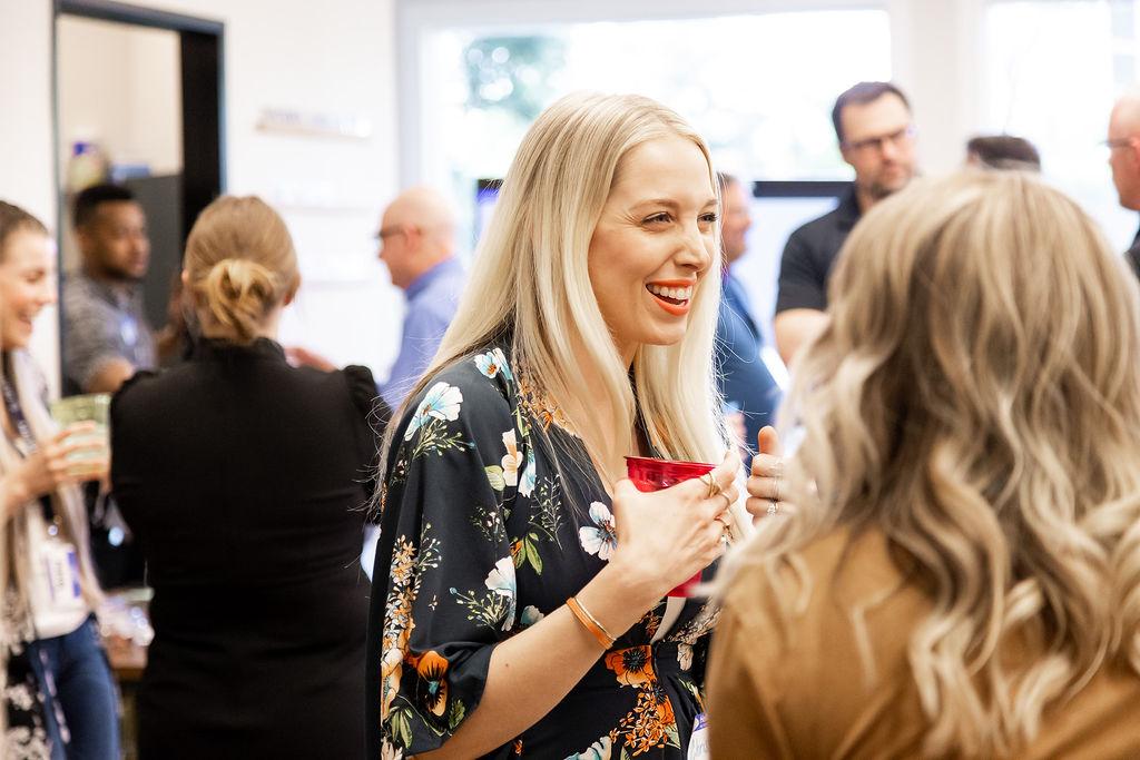 Woman laughing at networking event at Granite City Workspaces
